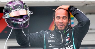 Mercedes' British driver Lewis Hamilton celebrates winning the Formula One Hungarian Grand Prix race at the Hungaroring circuit in Mogyorod near Budapest, Hungary, July 19, 2020. (AFP Photo)