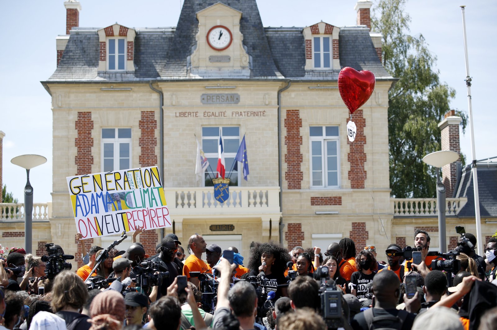 Assa Traore (C) delivers a speech prior to a demonstration against police brutality and racism in Beaumont-sur-Oise, near Paris, July, 18 2020. (EPA Photo)