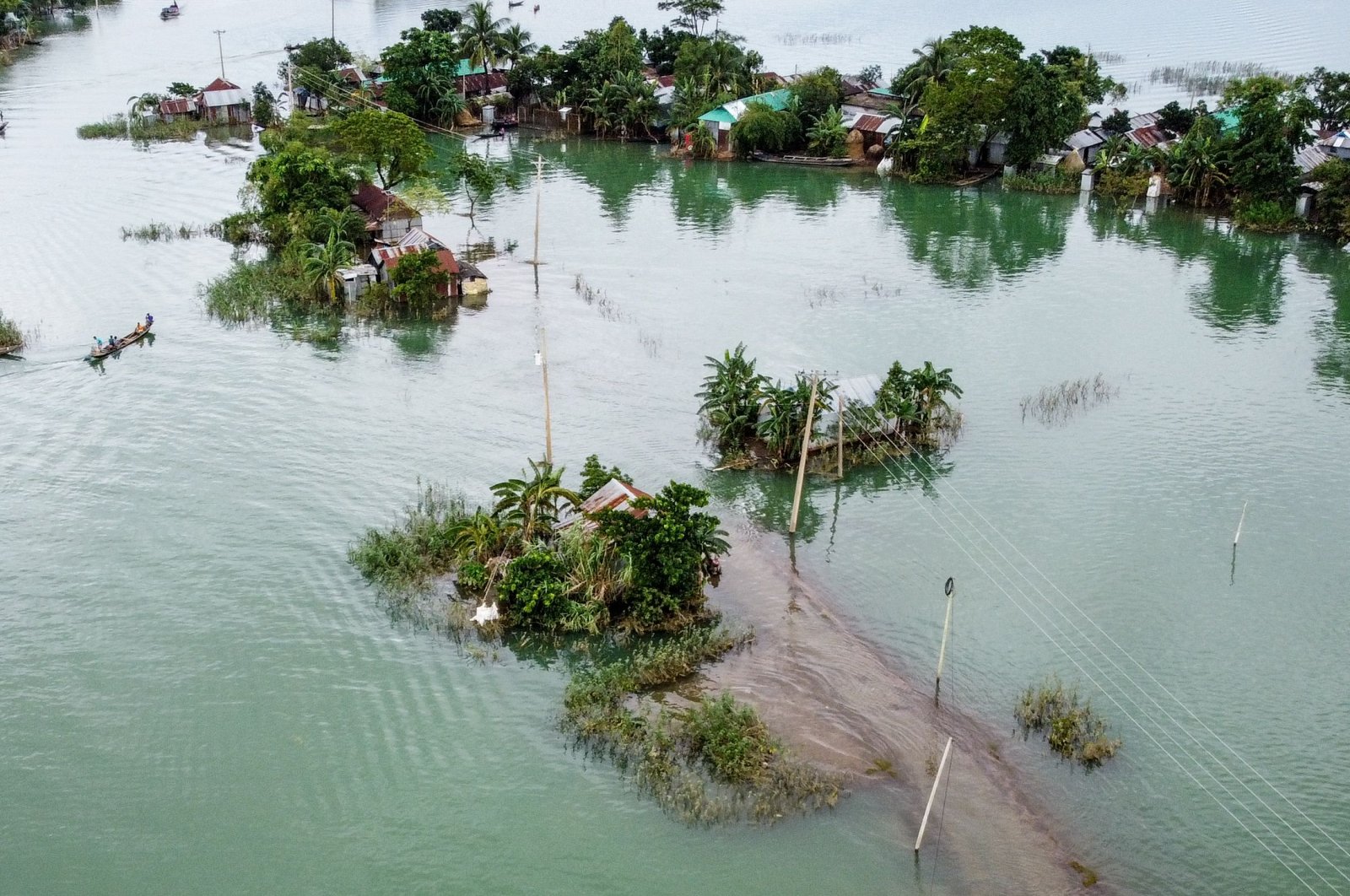 This aerial view shows flooded houses in Sunamganj, Bangladesh on July 15, 2020. (AFP Photo)