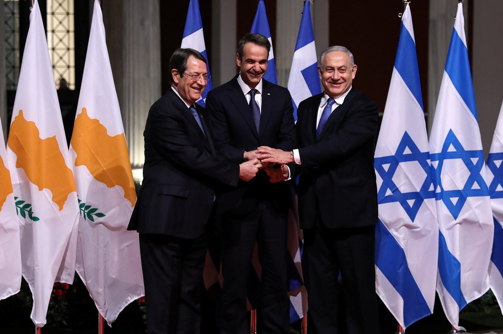 Greek Cypriot leader Nicos Anastasiades, Greek Prime Minister Kyriakos Mitsotakis and Israeli Prime Minister Benjamin Netanyahu pose for a photo before signing a deal to build the EastMed subsea pipeline to carry natural gas from the Eastern Mediterranean to Europe, at the Zappeion Hall in Athens, Greece, Jan. 2, 2020. (Reuters Photo)