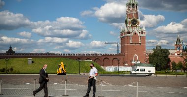 A Russian Federal Guard Service (FSO) officer (C) stands guard at the Kremlin with the Spasskaya Tower in the background, Moscow, Russia, July 10, 2020. (AP Photo)