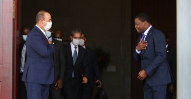 Turkish Foreign Minister Mevlüt Çavuşoğlu (L) is greeted by Togo's President Faure Gnassingbe (R) on an official visit to the capital Lome, Togo, July 20, 2020. (AA Photo)