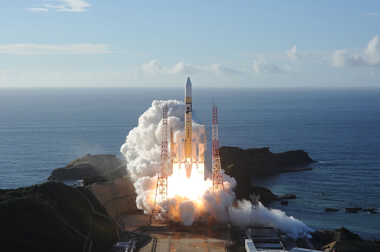 In this handout photograph taken and released on July 20, 2020 by Mitsubishi Heavy Industries an H-2A rocket carrying the Hope Probe known as "Al-Amal" in Arabic, developed by the Mohammed Bin Rashid Space Centre (MBRSC) in UAE to explore Mars, blasts off from Tanegashima Space Centre in southwestern Japan. (Mitsubishi Heavy Industries / AFP Photo) 