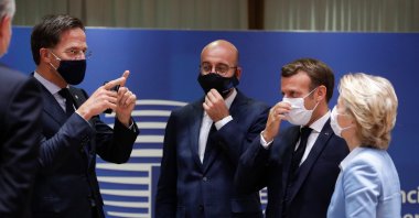 Dutch Prime Minister Mark Rutte (L), European Council President Charles Michel (2nd from L), French President Emmanuel Macron (2nd from R) and European Commission President Ursula von der Leyen (R) attend a round table meeting at an EU summit in Brussels, Belgium, July 21, 2020. (AP Photo)