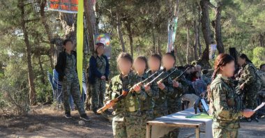 YPG/PKK's child soldiers receive training at an unknown location, Aug. 3, 2018. (AA Photo)