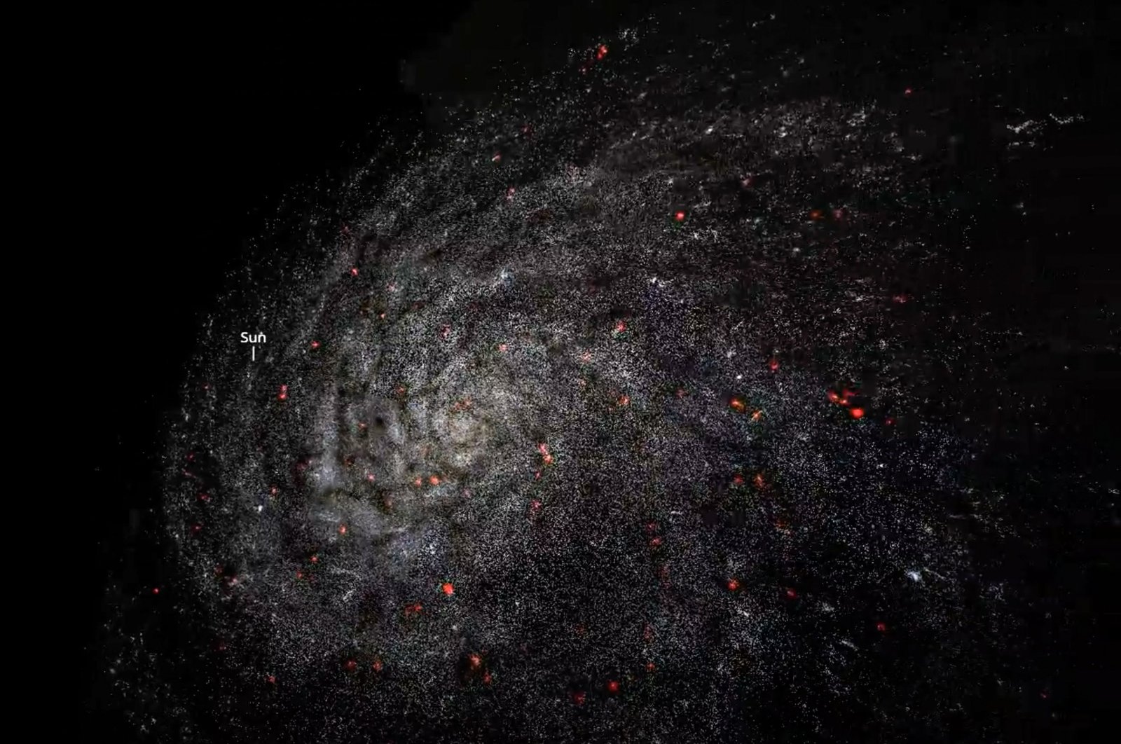 An image grab from a handout computer animation made available on July 19, 2020, by the Swiss Federal Institute of Technology Lausanne (EPFL) shows the Milky Way galaxy, with the location of the sun. (Photo by Handout / Swiss Federal Institute of Technology Lausanne / AFP)