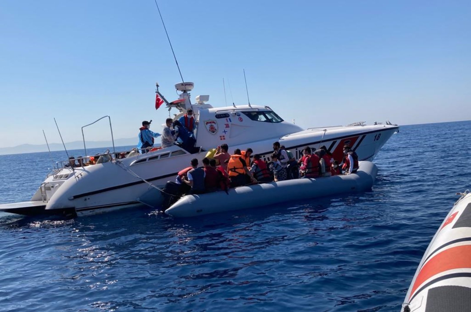 The Turkish coast guard saves the migrants in the Aegean Sea, July 21, 2020. (DHA Photo)