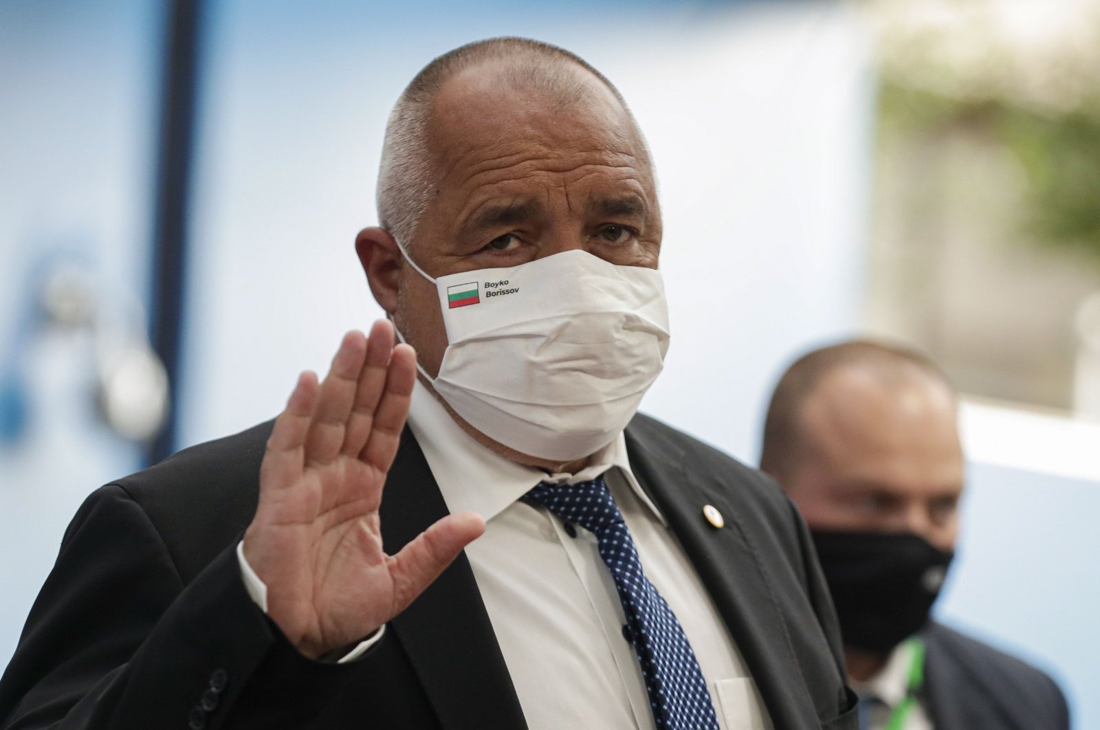 Bulgaria's Prime Minister Boyko Borissov, wearing a protective face mask, waves as he arrives for the fourth day of an EU summit at the European Council building in Brussels, on July 20, 2020. (AFP Photo)