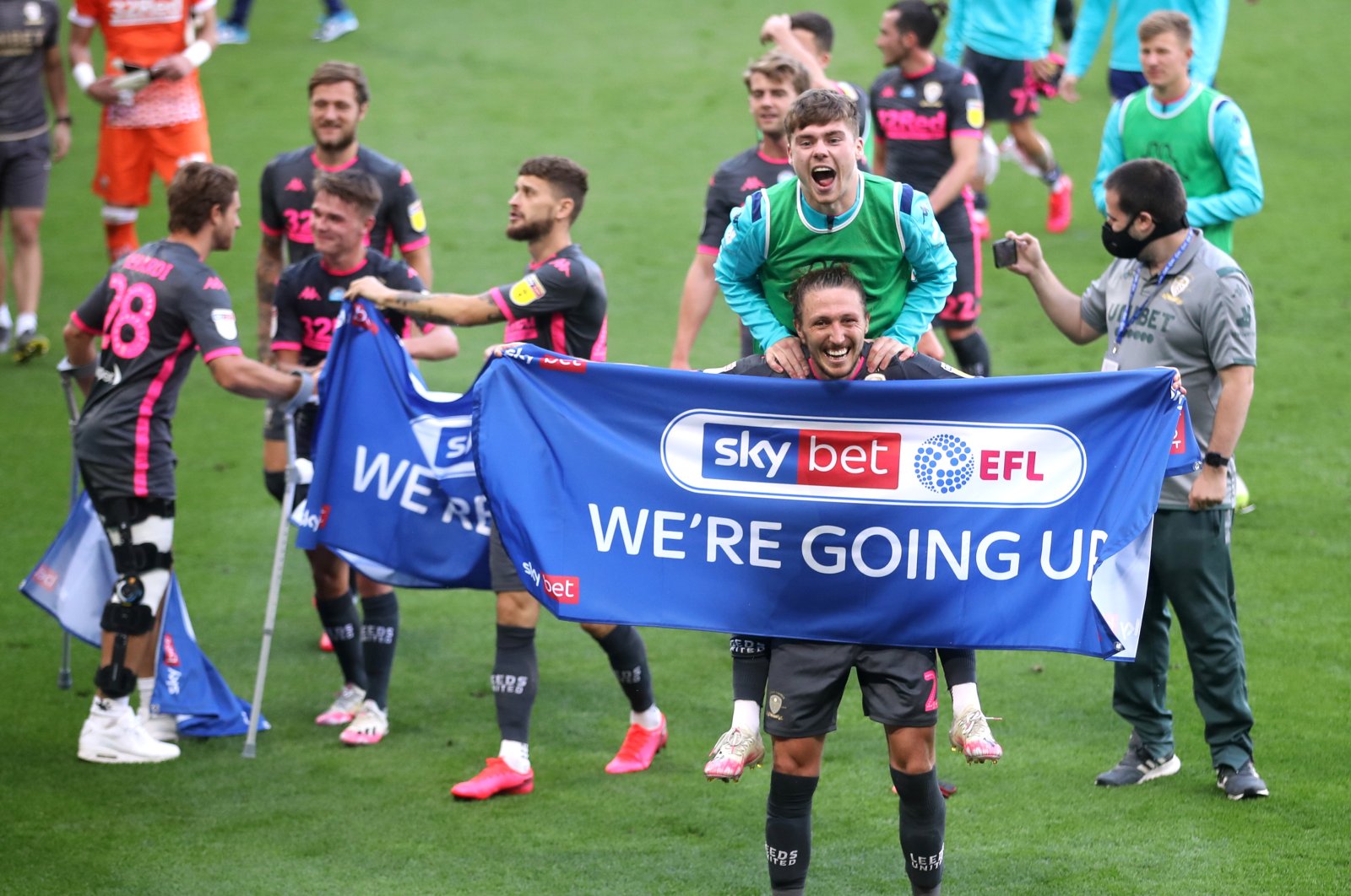 Leeds United's Luke Ayling (C) celebrates winning the  English Football League Championship, Derby, Britain, July 19, 2020. (Reuters Photo)