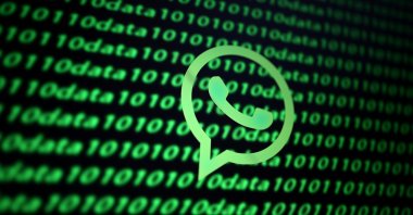 This illustration shows the Whatsapp logo with binary codes in the background. (Reuters Photo)