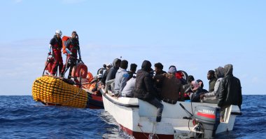 SOS Mediterranee team members from the humanitarian ship Ocean Viking approach a boat in distress with 30 people on board in the waters off Libya, Nov. 20, 2019. (AP Photo)