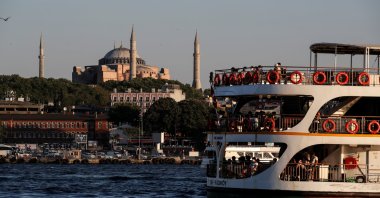 A ferry sails through the waters of the Marmara Sea as Hagia Sophia stands in the background in Istanbul, July 22, 2020. (Reuters Photo)