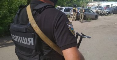 Ukrainian law enforcement officers are seen near a site where a man armed with a grenade holds a policeman hostage in Poltava, Ukraine, July 23, 2020. (Reuters Photo)