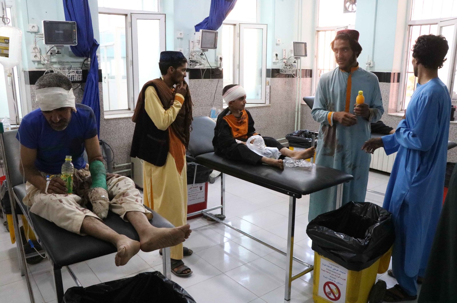 People who were injured in an alleged airstrike by Afghan security forces on suspected Taliban hideouts in Gozara district, receive medical treatment after they were brought to a hospital in Herat, Afghanistan, July 22, 2020. (EPA Photo)