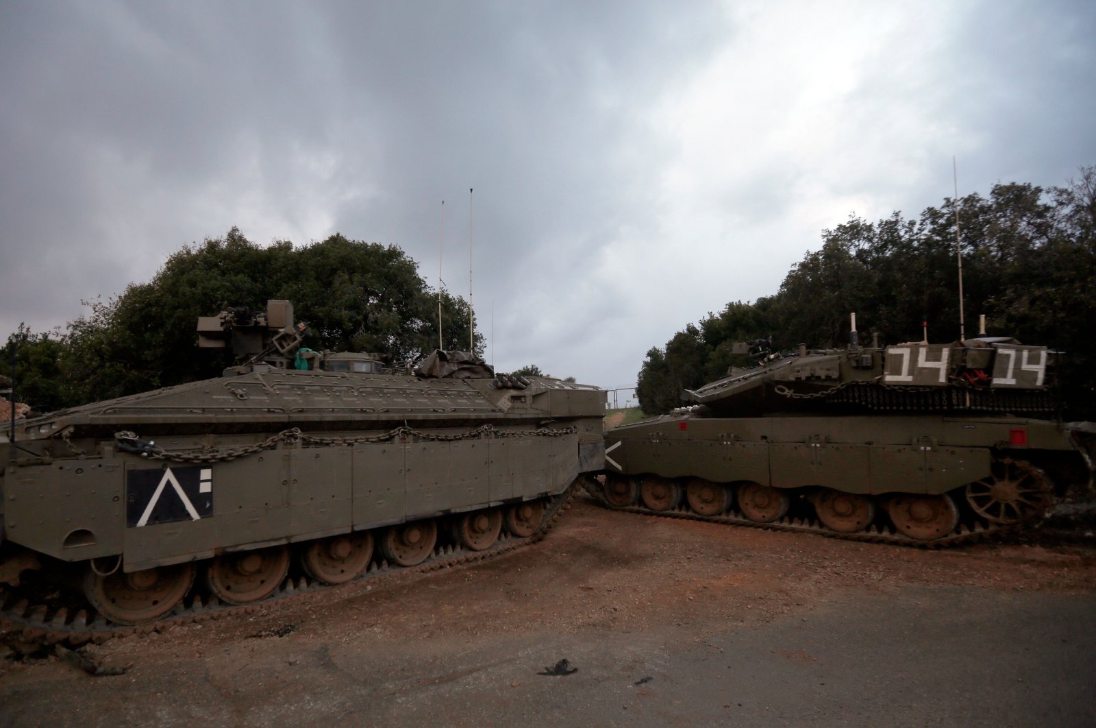 Israeli Merkava tanks park near the border with Lebanon, near the Israeli town of Zarit, Dec. 5, 2018. (AFP Photo)