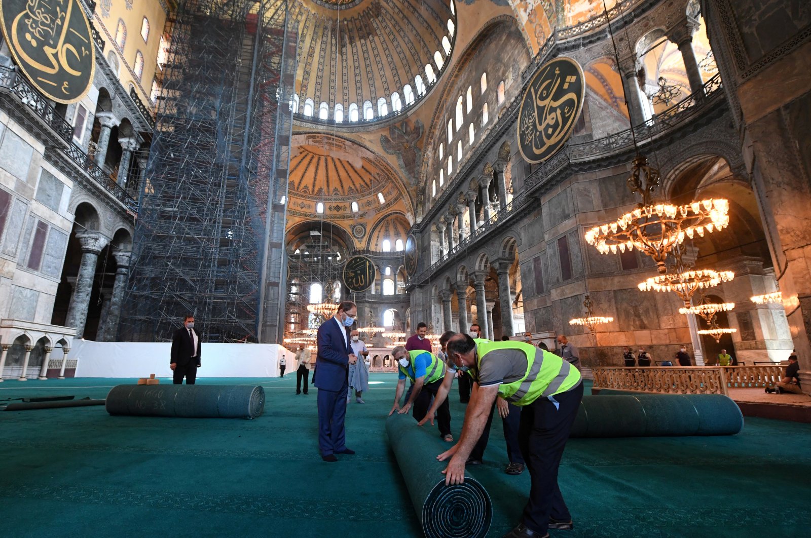 Head of Turkey's Religious Affairs Directorate (Diyanet) Ali Erbaş visits Hagia Sophia Mosque as workers lay carpets in Istanbul, July 22, 2020. (Reuters Photo)