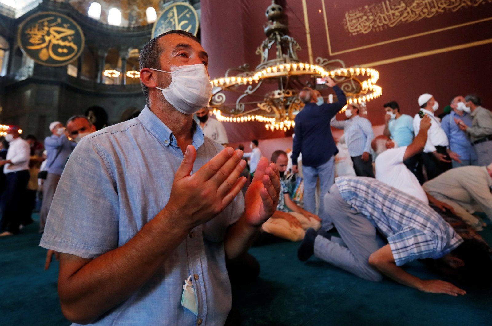 People pray as they visit Hagia Sophia Grand Mosque after Friday prayers, in Istanbul, July 24, 2020. (REUTERS Photo)
