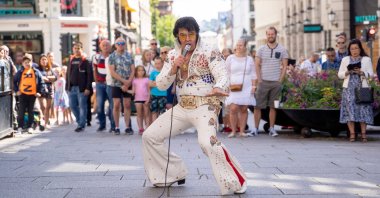 Norwegian artist Kjell Elvis (Kjell Henning Bjornestad) performs in central Oslo in an attempt to beat the record of the world's longest Elvis Presley singing marathon in Oslo, Norway on July 23, 2020. (AFP Photo)