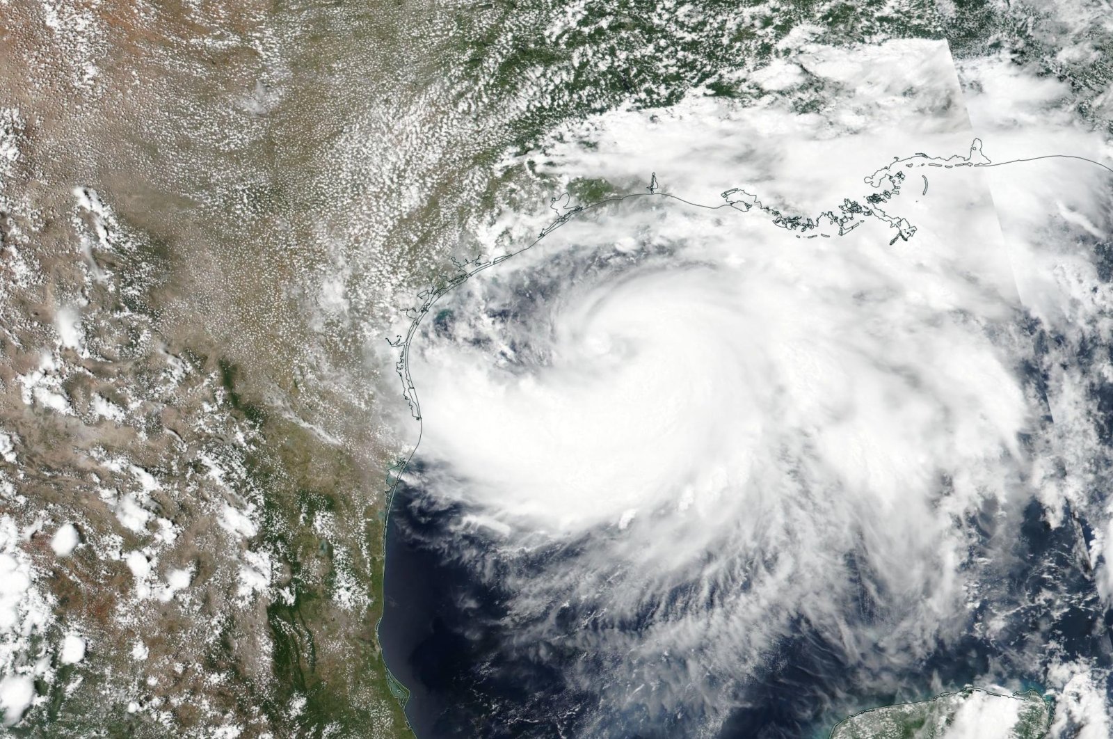 A handout satellite image made available by the National Aeronautics and Space Administration shows Tropical Storm Hanna as it moves trough the Gulf of Mexico and approaches Texas, 24 July 2020 (issued 25 July 2020). (EPA Photo/NASA Handout)
