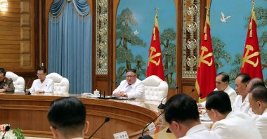 This picture taken on July 25, 2020 and released from North Korea's official Korean Central News Agency (KCNA) on July 26 shows North Korean leader Kim Jong Un (C, top) attending an emergency enlarged meeting of Political Bureau of WPK Central Committee at an undisclosed location. (AFP Photo)