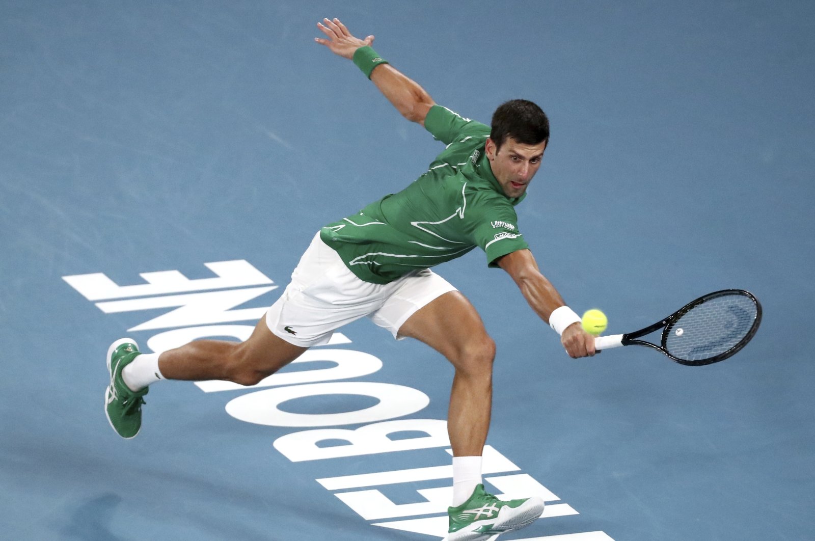 Novak Djokovic makes a backhand return to Dominic Thiem during the Australian Open final in Melbourne, Australia, Feb. 2, 2020. (AP Photo)