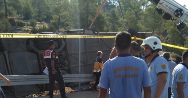 A rescue team retrieves the bus that toppled over in Turkey's southern province Mersin, July 27, 2020. (AA Photo)