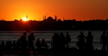 People enjoy a summer day as the sun sets in Istanbul, July 22, 2020. (Reuters Photo)
