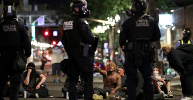 Demonstrators sit on the street during a protest against racial inequality and police violence, Portland, Oregon, U.S., July 27, 2020. (Reuters Photo)