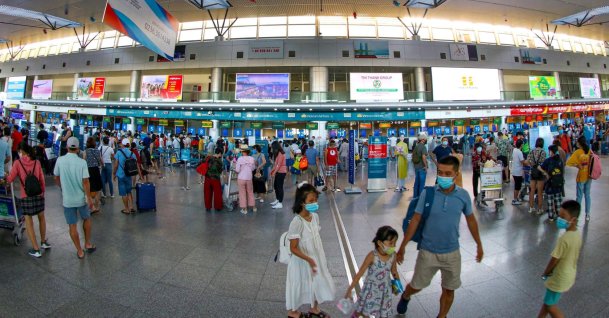 People wearing face masks at Da Nang International Airport as cases surge across the world, in Vietnam, July 26, 2020. (EPA Photo)
