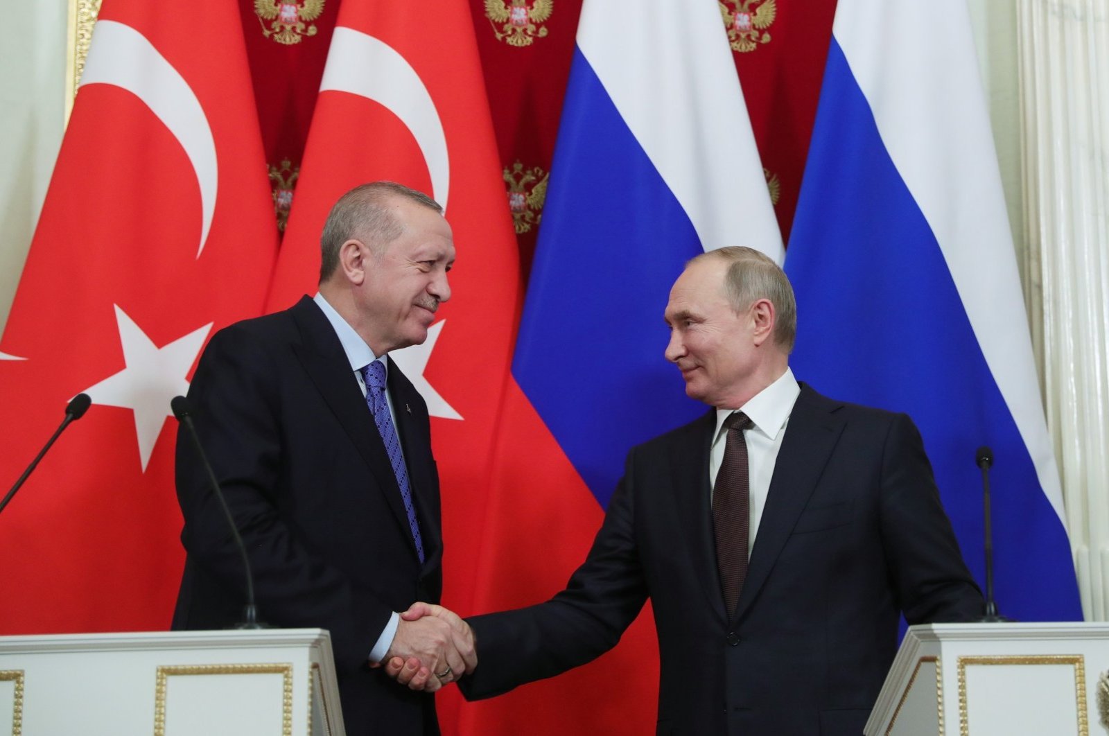 President Recep Tayyip Erdoğan shakes hand with his Russian counterpart Vladimir Putin following a press conference in Moscow, March 6, 2020. (AA Photo)