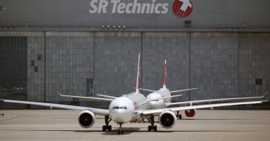 Two aircraft of Swiss Airlines are seen in front of a hangar of aircraft service provider SR Technics, as the spread of the coronavirus continues, at Zurich Airport, Switzerland, July 14, 2020. (REUTERS Photo)