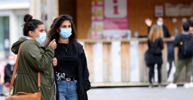 People wear protective face masks as a precaution against the coronavirus in Belgium's capital Brussels, July 28, 2020. (AA Photo)
