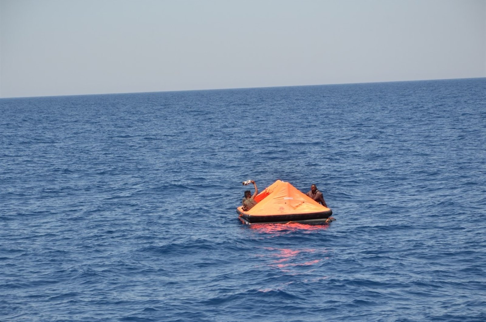A migrant boat is seen off the coast of Izmir's Foça district in southwestern Turkey, July 28, 2020. (DHA Photo)
