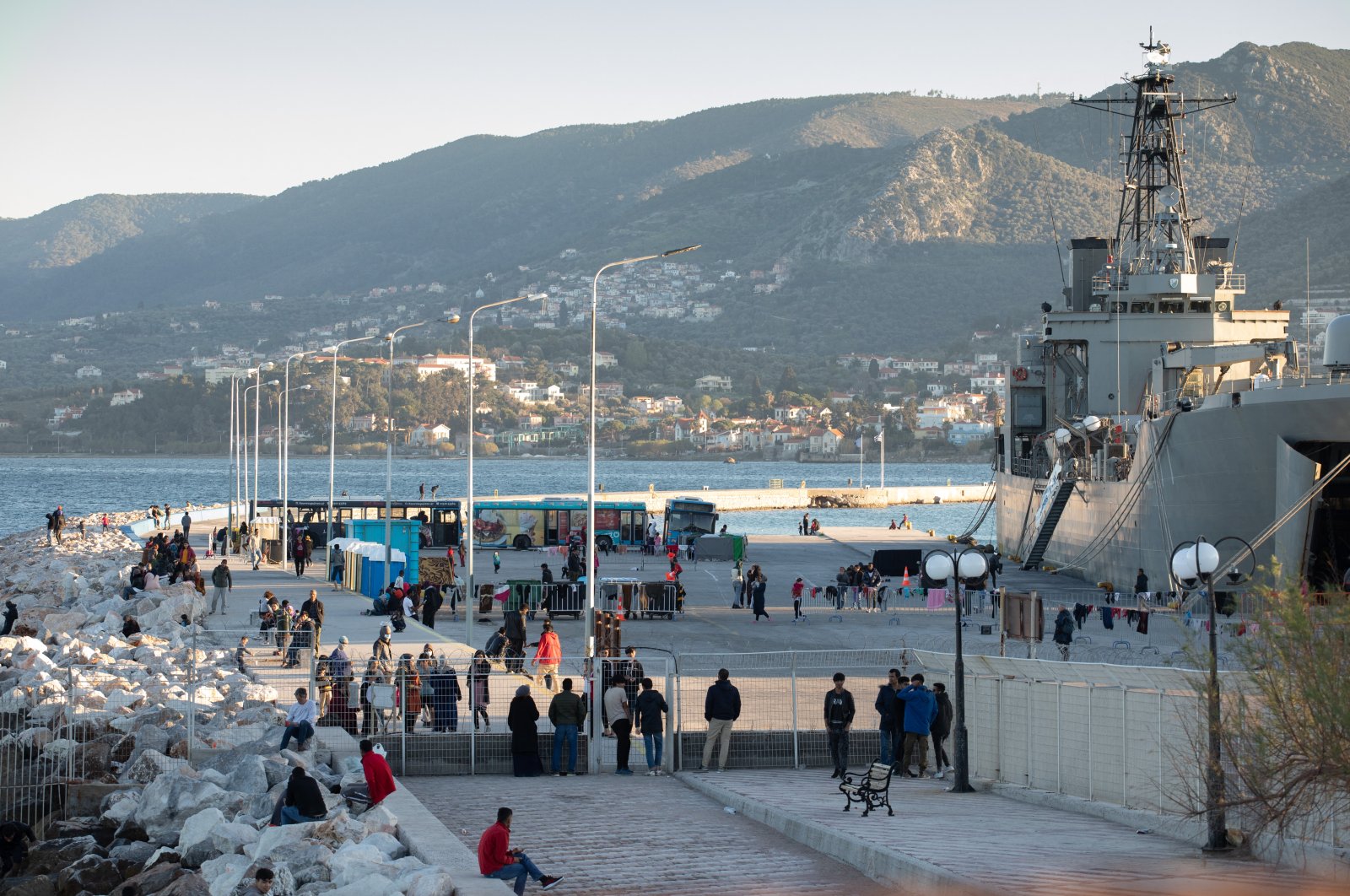 A Greek navy ship serves as a temporary shelter for 400-600 migrants who have arrived since the beginning of March in the port of Mytilene on the Greek island of Lesbos, following Turkey's decision to open its borders and Greece's decision to stop registering new asylum applications, March 15, 2020. (Reuters Photo)