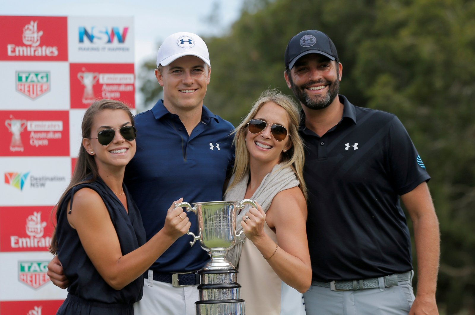 Jordan Spieth (second L) poses with the Stonehaven Cup after winning the Australian Open alongside his girlfriend Annie Verret (L), his caddie Michael Greller (R) and Greller's wife Ellie, Nov. 20, 2016. (REUTERS Photo)
