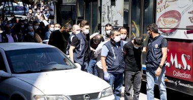Police escort suspects of a drug gang to a courthouse in Ankara, Turkey, July 6, 2020. (AA Photo)