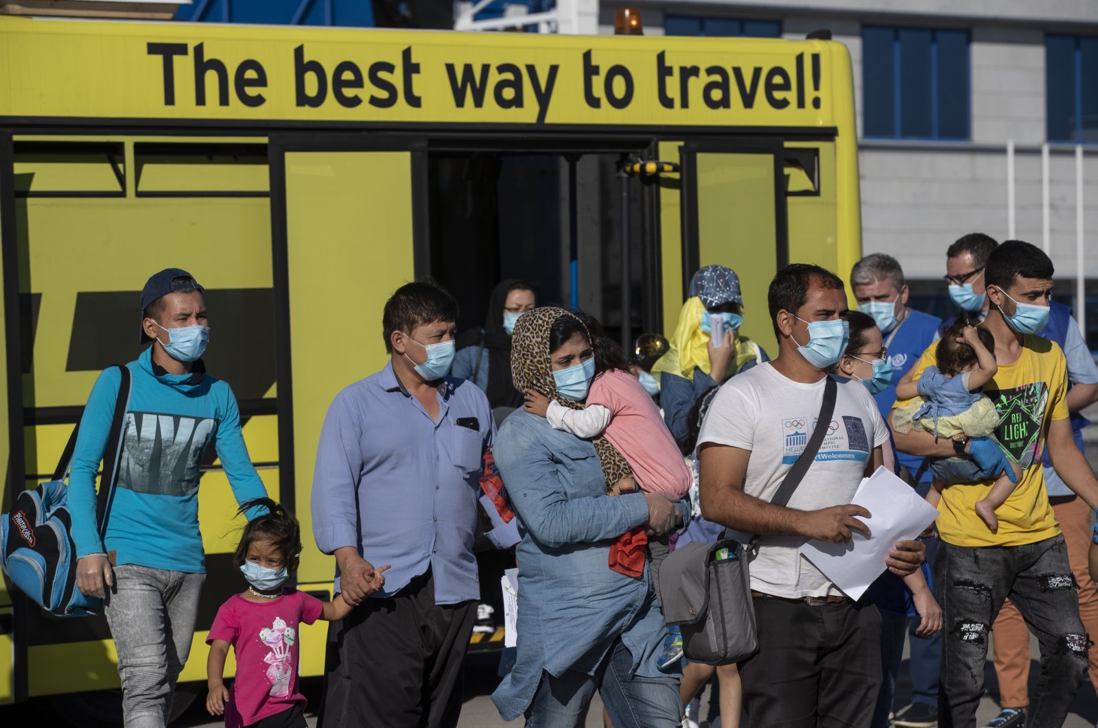 A group of migrant children with health issues board a plane to Germany, at Athens International Airport, Spata-Artemida, Greece, July 24, 2020. (AP Photo)