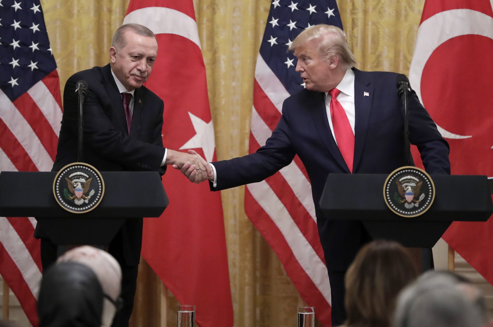President Recep Tayyip Erdoğan (L) and U.S. President Donald Trump shake hands during a news conference in the East Room of the White House, Washington, Nov. 13, 2019. (AP Photo)