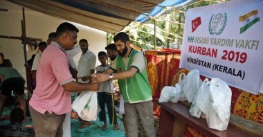Staff members of the Turkish charity IHH deliver aid on the occasion of Qurban Bayram, in Kerala, India, Aug. 12, 2019. (Courtesy of IHH)