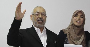 Rashid al-Ghannushi, Tunisian leader and founder of the moderate party Ennahda, celebrates an electoral victory with his daughter at the party's headquarters in Tunis, Tunisia, Oct. 27, 2011. (AP Photo)