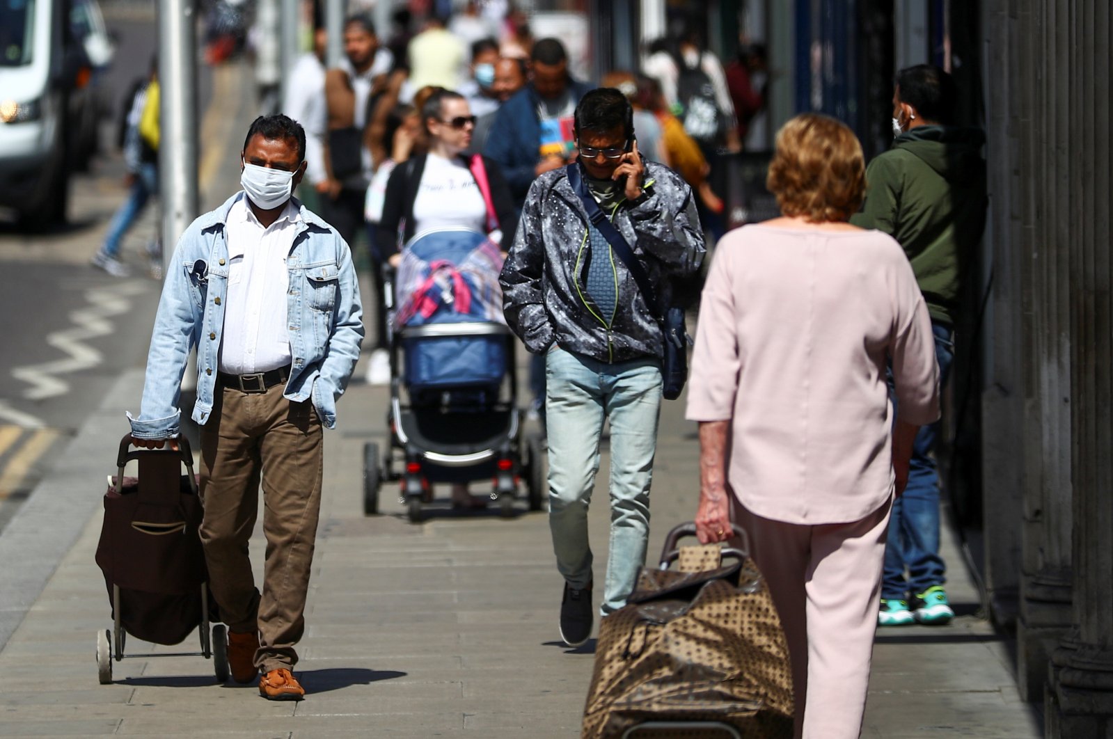 People walk down a street following the coronavirus outbreak, London, Britain, July 29, 2020. (Reuters Photo)