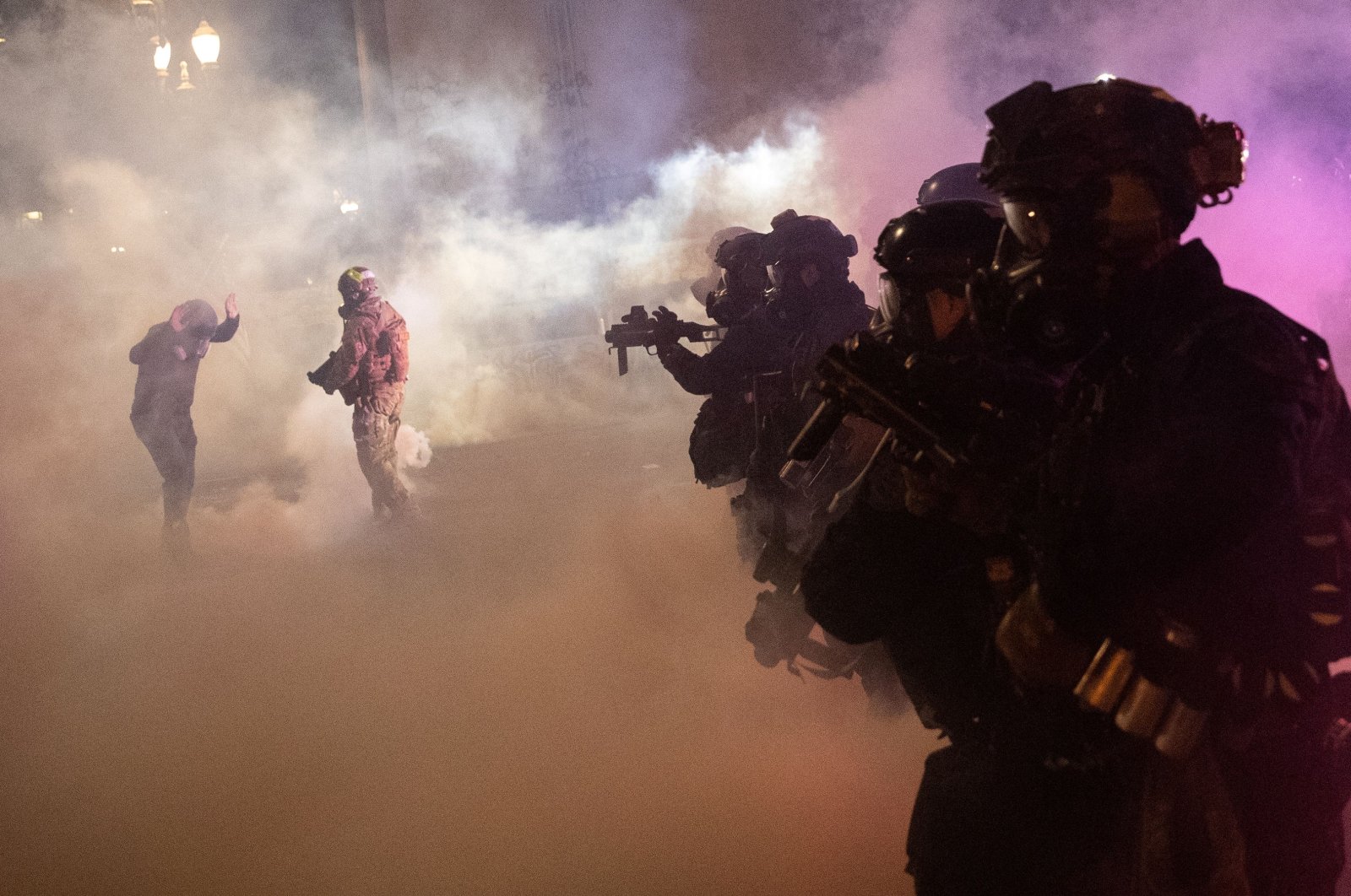 Federal law enforcement officers fire tear gas and other munitions to disperse protesters during a demonstration against police violence and racial inequality in Portland, Oregon, U.S., July 30, 2020. (Reuters Photo)