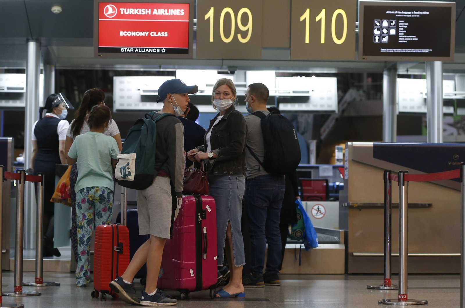 Passengers complete their check-ins for an Istanbul-bound Turkish Airlines flight at Vnukovo Airport in Moscow, Russia, Aug. 1, 2020. (AA Photo)