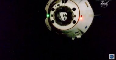 A handout picture made available by the National Aeronautics and Space Administration (NASA) shows the SpaceX Crew Dragon spacecraft, carrying NASA astronauts Robert Behnken and Douglas Hurley, undocking from the International Space Station (ISS), 01 August 2020. (EPA Photo)