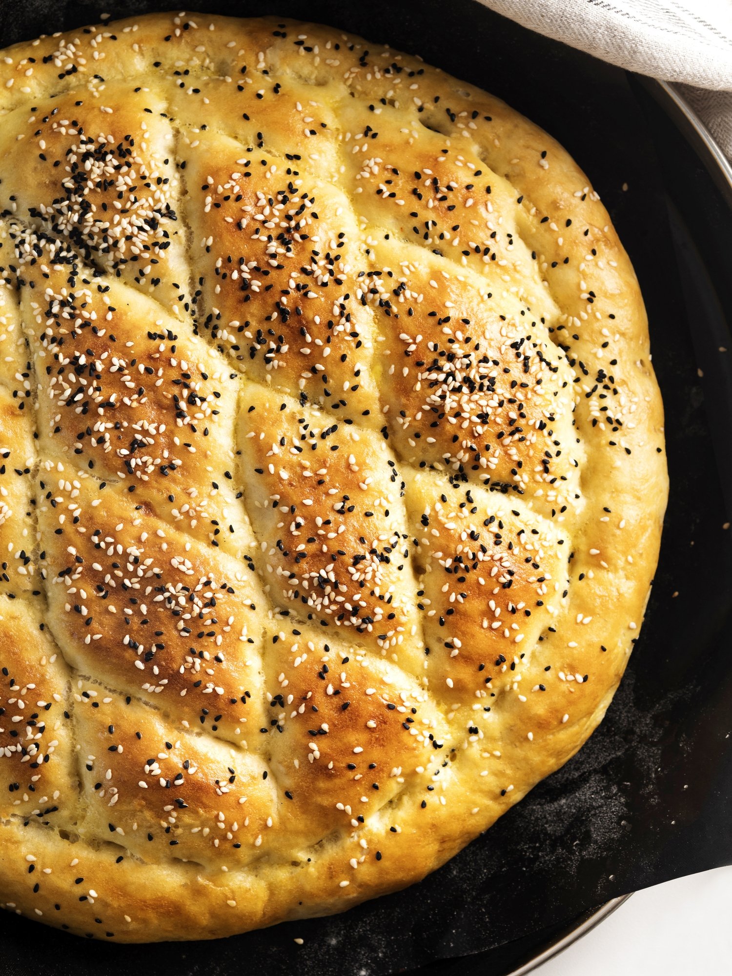 Decorated with sesame and nigella seeds, the Ramazan pide is a staple food in Turkey. (iStock Photo)