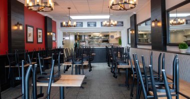 Chairs are stacked on tables in the empty dining room of Maria's Italian Kitchen now closed due to the COVID-19 pandemic in Santa Monica, California on July 28, 2020. (AFP Photo)