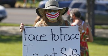 A teacher attends a Utah Safe Schools Mask-In urging the governor's leadership in school reopening during a rally in Salt Lake City, Utah, U.S., July 23, 2020. (AP Photo)