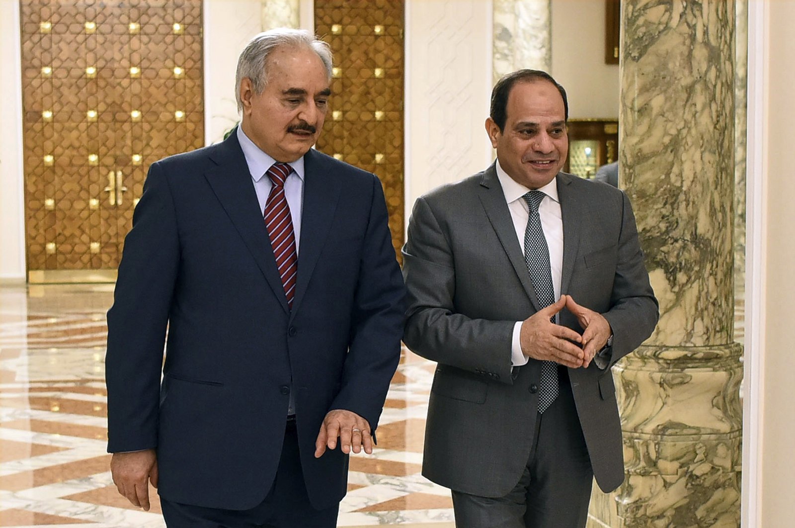 Egyptian President Abdel-Fattah el-Sissi, (R), walks with Libya's putschist Gen. Khalifa Haftar, in Cairo, Egypt,  May 9, 2019. (AP)