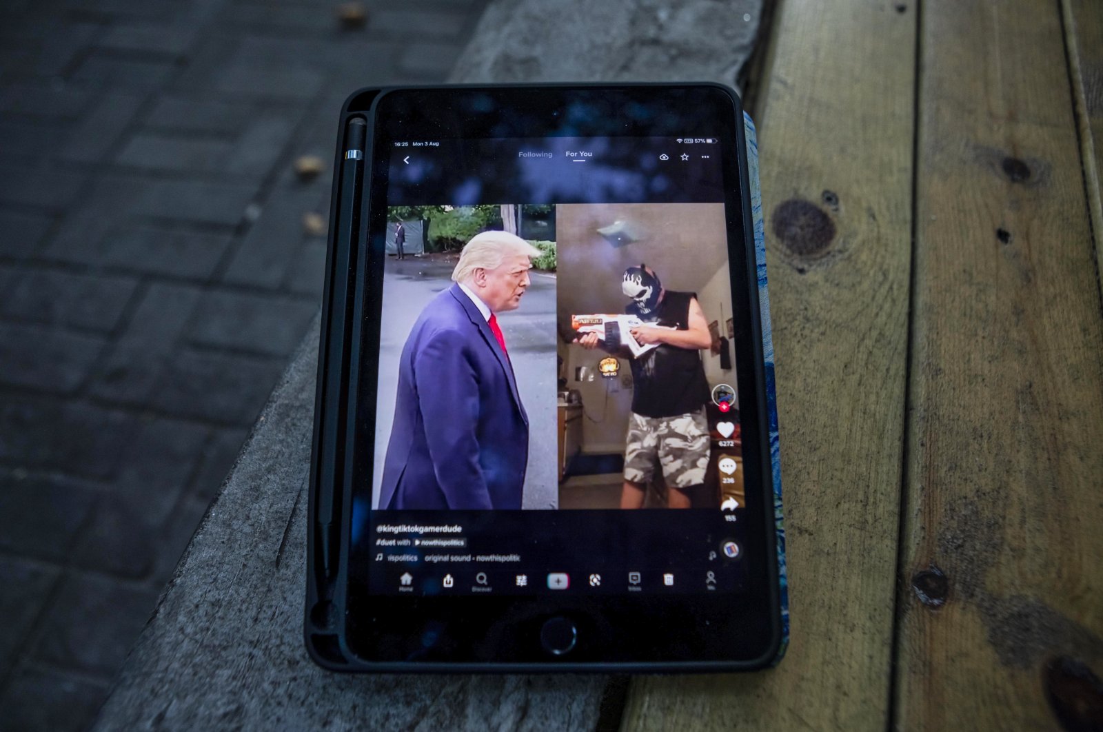 U.S. President Donald Trump is seen in a TikTok app post on a phone resting on a bench in Shanghai, China, Aug. 3, 2020. (EPA Photo)