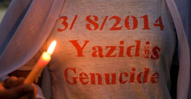 Iraqi Yazidis attend a candle-lit vigil in the Sharya area, some 15 km (9 miles) from the northern city of Dohuk in the autonomous Iraqi Kurdistan Regional Government (KRG) region, marking the sixth anniversary of the Daesh attack on the Yazidi community in the northwestern Sinjar district of Iraq, Aug. 3, 2020. (AFP Photo)